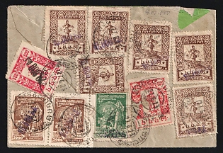 1923 SOVIET GEORGIA Cover of international registered letter sent from Manglis to Wien (Austria). Franked with six violet overprinted stamps 10.000rub/1.000rub., two 20.000rub. black overprint on 500rub. type IV (one damaged), one 40.000rub./5.000rub. type V and pair of violet overprints of 80.000rub./3.000rub. Total 300.000rub. within the current valid rate for international registered letter. Rare cancellation of Manglis in Georgian, as well hand drawn frame of registered label. Rare